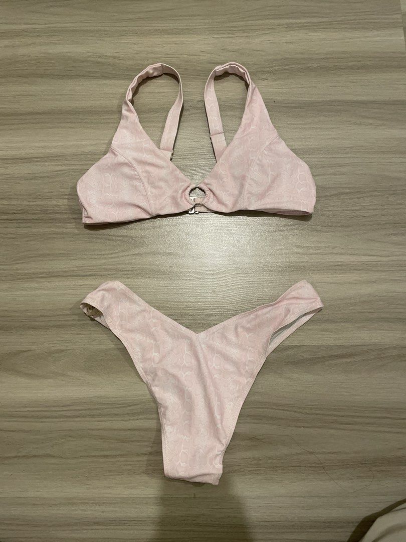 Pink Textured Bikini Set with Ring Detail (Category: Bikinis & Swimsuits) located in Manila. Submitted by possiblymaybe.717 (Listing ID 1459831515, Image 1). Description: - Adorable pink bikini set - Textured fabric with a subtle pattern - Top features a stylish center ring detail - Cheeky cut bottoms for a flattering fit - Ideal for beach days, pool parties, or your next vacation!.