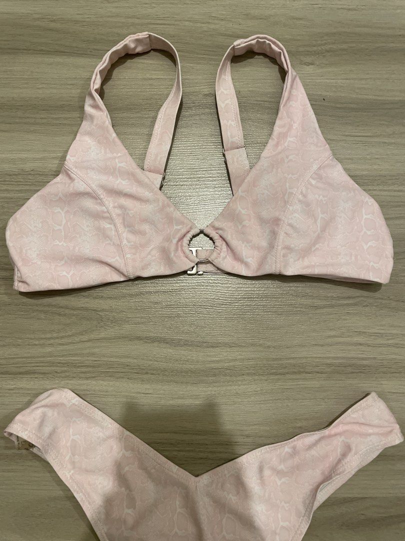 Pink Textured Bikini Set with Ring Detail (Category: Bikinis & Swimsuits) located in Manila. Submitted by possiblymaybe.717 (Listing ID 1459831515, Image 2). Description: - Adorable pink bikini set - Textured fabric with a subtle pattern - Top features a stylish center ring detail - Cheeky cut bottoms for a flattering fit - Ideal for beach days, pool parties, or your next vacation!.