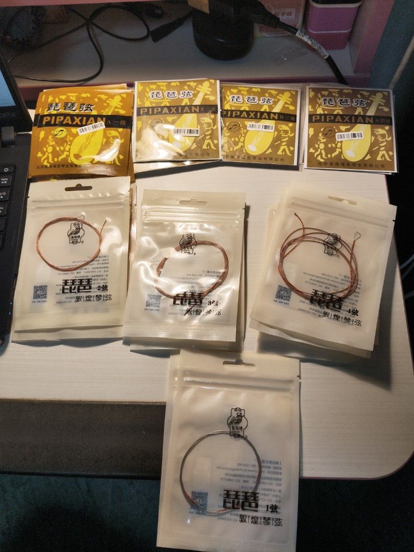 Pipa String (Category: Music Accessories) located in Singapore. Submitted by clouddd520 (Listing ID 1459813947, Image 1). Description: - Full set of pipa strings - High-quality strings for optimal sound - Available to purchase as a complete set - Single string requests can be accommodated via direct message.