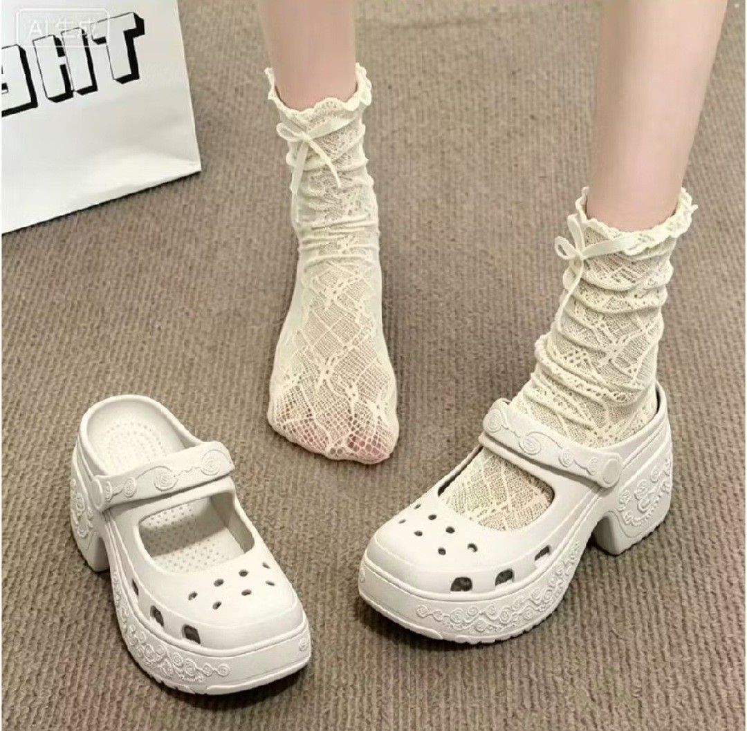 Platform Mary Jane Crocs - White (Category: Flats & Sandals) located in Manila. Submitted by honeypatch (Listing ID 1459729576, Image 2). Description: - White platform Mary Jane style Crocs - Chunky heel for added height - Cute rose pattern around the sole - Adjustable strap (can be worn up or down) - Unique and stylish addition to any outfit - Easy to clean and comfortable for all-day wear - Size EU 39-40 | 8-9 US Womens - RFS: Wrong Size - Supe