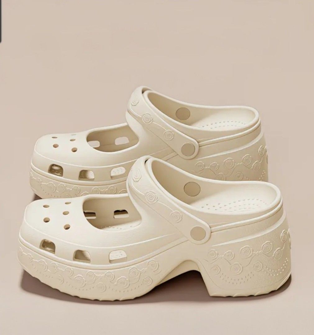 Platform Mary Jane Crocs - White (Category: Flats & Sandals) located in Manila. Submitted by honeypatch (Listing ID 1459729576, Image 1). Description: - White platform Mary Jane style Crocs - Chunky heel for added height - Cute rose pattern around the sole - Adjustable strap (can be worn up or down) - Unique and stylish addition to any outfit - Easy to clean and comfortable for all-day wear - Size EU 39-40 | 8-9 US Womens - RFS: Wrong Size - Supe