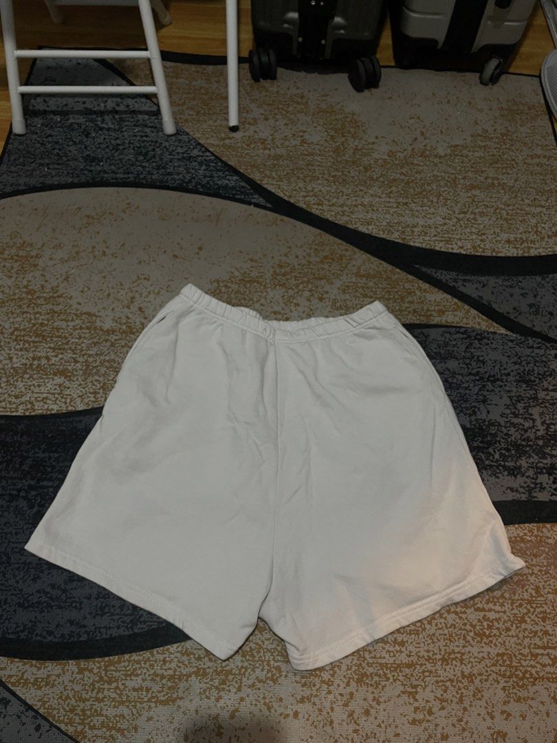 Playboy White Shorts with Graphic Print - Size M (Category: Shorts) located in Lapu Lapu. Submitted by ruby_welly22 (Listing ID 1459803577, Image 2). Description: - Features the classic Playboy bunny logo graphic on the left leg. - Playboy text printed vertically on the right leg. - Elastic waistband for a comfortable fit. - Made from a soft cotton-polyester blend. - Ideal for everyday casual wear..
