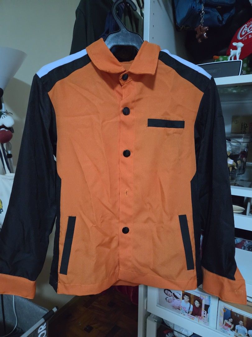 PLV OJT UNIFORM (Category: Looking For) located in Caloocan City. Submitted by mluck (Listing ID 1459700005, Image 1). Description: width : 19inches c length: 24 inches - Stylish orange jacket with contrasting black sleeves and collar. - White stripe detail across the shoulders for a sporty look. - Two chest pockets with black button closures. - Front closure with black buttons. - Ideal for a cool, casual everyday outfit..