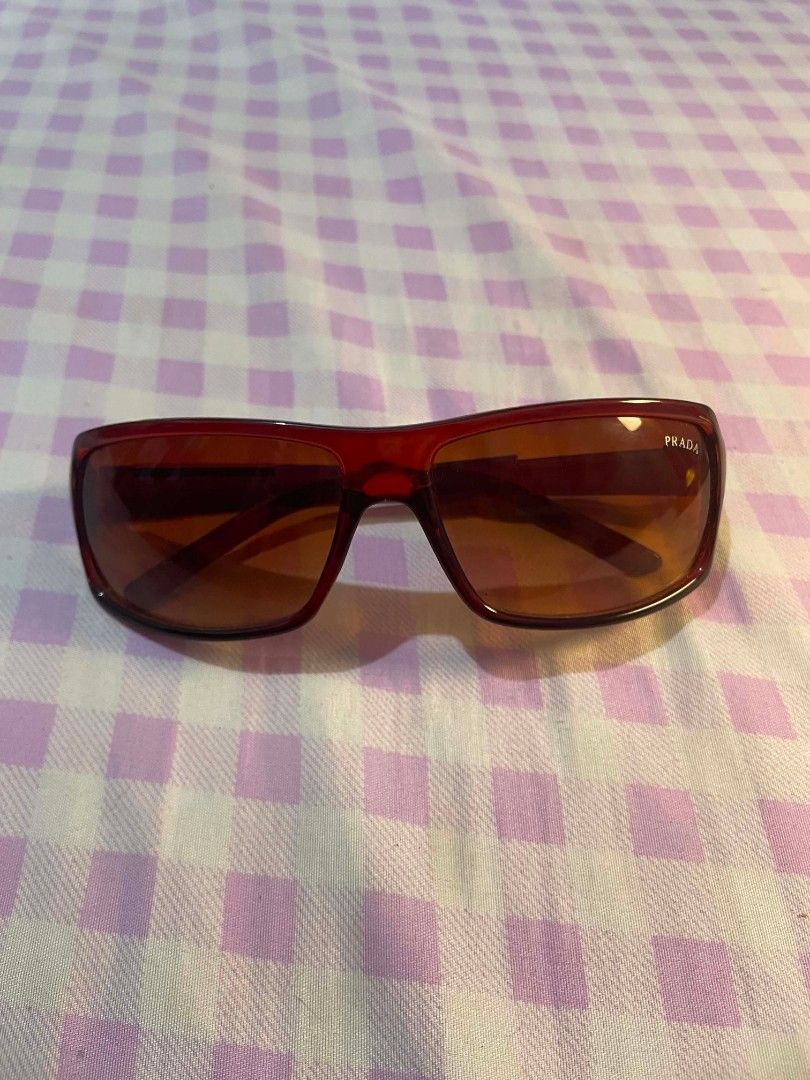 Vintage / Y2K Prada Sunglasses (Category: Sunglasses & Eyewear) located in Quezon City. Submitted by lovenzie (Listing ID 1459821162, Image 1). Description: LAST PRICE !! - authentic vintage prada sunglasses - y2k / mid-2000s - red frame with amber gradient lenses - made in Italy - selling as is! no box, etc 🛍️🍡 ౨ৎ⋆ ˚｡ mop: gcash shipping: lalamove / grab ( shipping fee will be shouldered by the buyer ) 🍰 loc: qc !.
