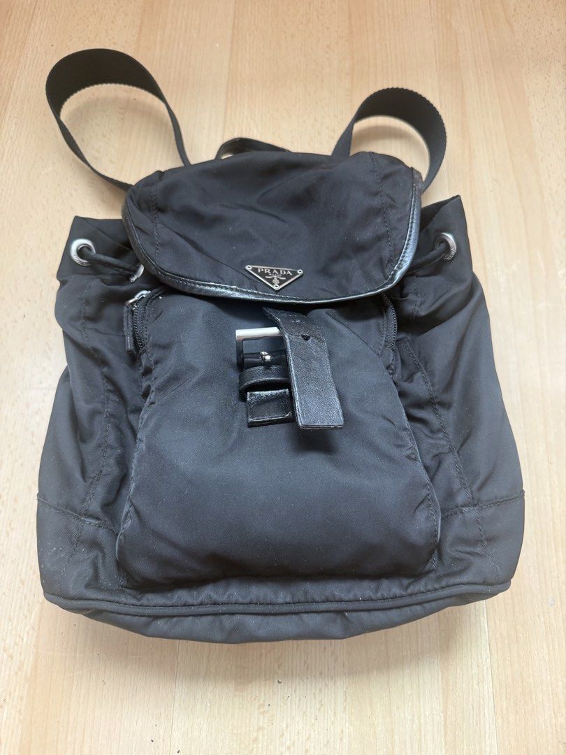 Prada Nylon Backpack Black (Category: Luxury Bags & Wallets) located in Makati City. Submitted by dgcurated09 (Listing ID 1459807131, Image 1). Description: - Classic Prada backpack - Black nylon material - Leather trim and silver hardware - Drawstring closure with buckle flap - Adjustable shoulder straps - Perfect for everyday use No dustbag.
