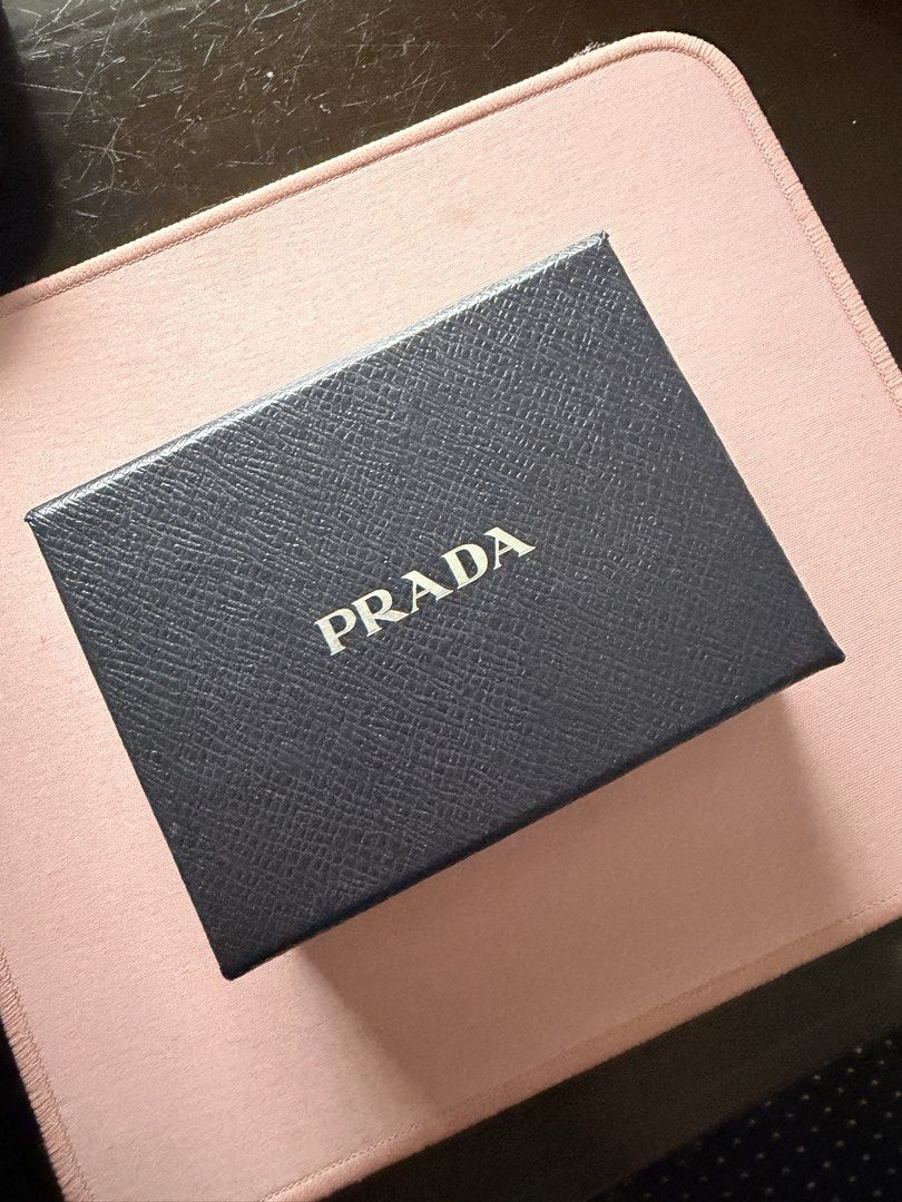 Prada Saffiano Leather Key Holder Black (Category: Luxury Bags & Wallets) located in Manila. Submitted by thraciecapule (Listing ID 1459726305, Image 2). Description: - Authentic Prada Key Holder - Material: Black Saffiano Leather - Hardware: Gold - Includes: Original Prada Box - Origin: Made in Italy - Benefit: Stylish and organized key keeping.