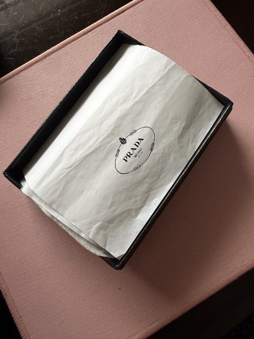 Prada Saffiano Leather Key Holder Black (Category: Luxury Bags & Wallets) located in Manila. Submitted by thraciecapule (Listing ID 1459726305, Image 3). Description: - Authentic Prada Key Holder - Material: Black Saffiano Leather - Hardware: Gold - Includes: Original Prada Box - Origin: Made in Italy - Benefit: Stylish and organized key keeping.