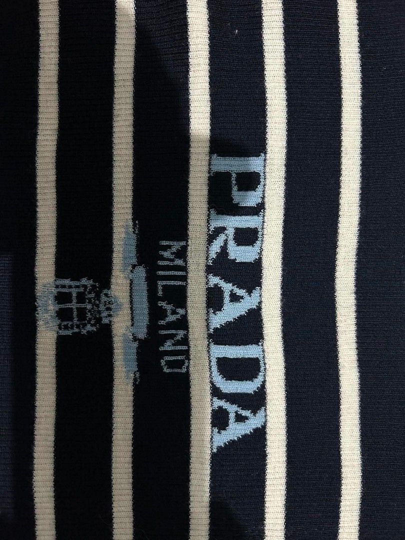Prada Striped Knit Sweater Milano (Category: Luxury Apparel) located in Manila. Submitted by susanbril09644 (Listing ID 1459702082, Image 3). Description: Navy and white striped knit sweater from Prada. Features the Prada Milano logo printed on the chest. Made in Italy. Size xs to small. Great for layering or wearing on its own..