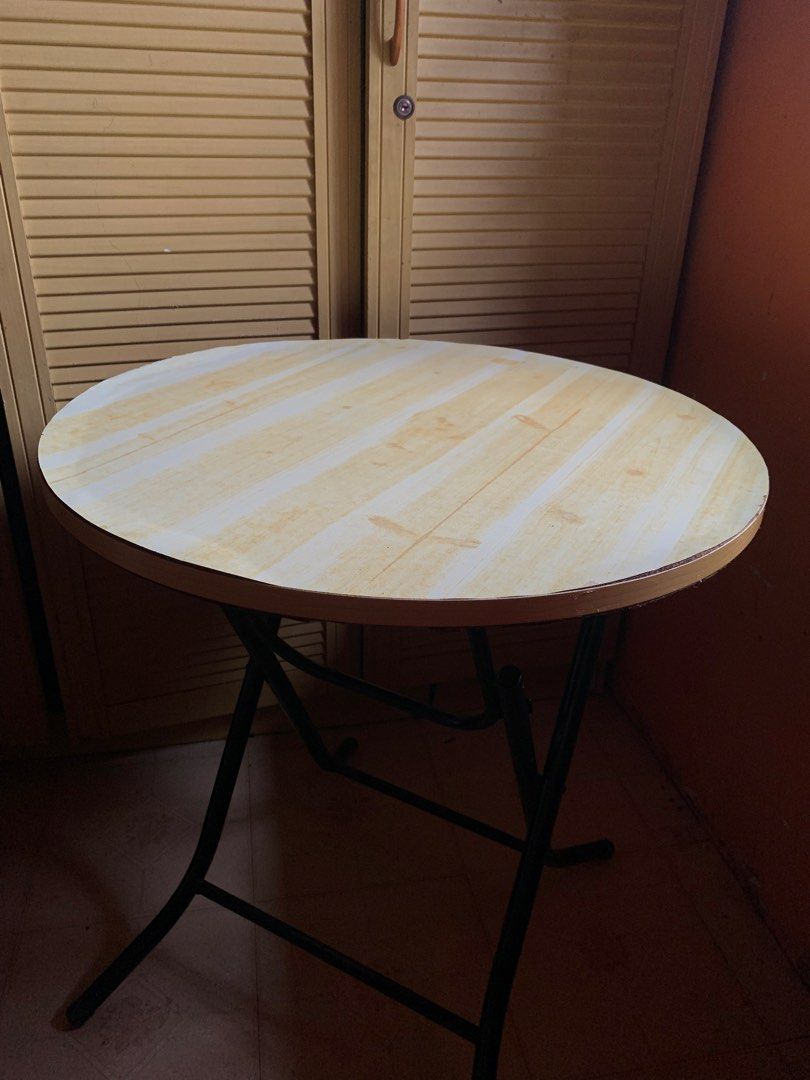 PRELOVED | Round Folding Table (Category: Tables & Sets) located in Dasmarinas. Submitted by byveloura (Listing ID 1459856189, Image 2). Description: PRELOVED | Round Folding Table ₱300 > used condition with visible signs of usage, but still sturdy, usable, and foldable. Please check all photos carefully before buying. Selling as-is. 📌 Pick-up or delivery only! (delivery fee shouldered by buyer) 📍 DASMA.