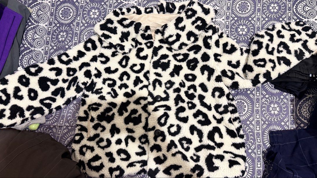 Preloved!!! Leopard Print Fuzzy Jacket (Category: Coats, Jackets and Outerwear) located in Manila. Submitted by casayuranhannahmae.1 (Listing ID 1459704578, Image 1). Description: - Super cozy fuzzy jacket - Stylish leopard print - Cream lining for extra comfort - Functional buttons down the front - Note: One button is missing on the cuff and front - Ideal for staying warm and fashionable - LP: 350 to 400 only!.