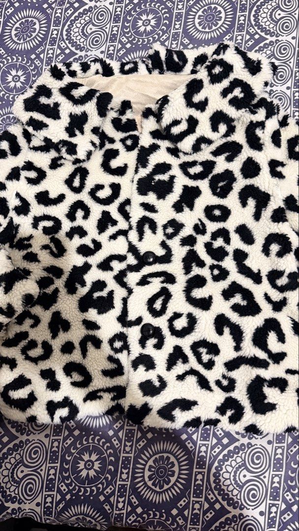 Preloved!!! Leopard Print Fuzzy Jacket (Category: Coats, Jackets and Outerwear) located in Manila. Submitted by casayuranhannahmae.1 (Listing ID 1459704578, Image 2). Description: - Super cozy fuzzy jacket - Stylish leopard print - Cream lining for extra comfort - Functional buttons down the front - Note: One button is missing on the cuff and front - Ideal for staying warm and fashionable - LP: 350 to 400 only!.