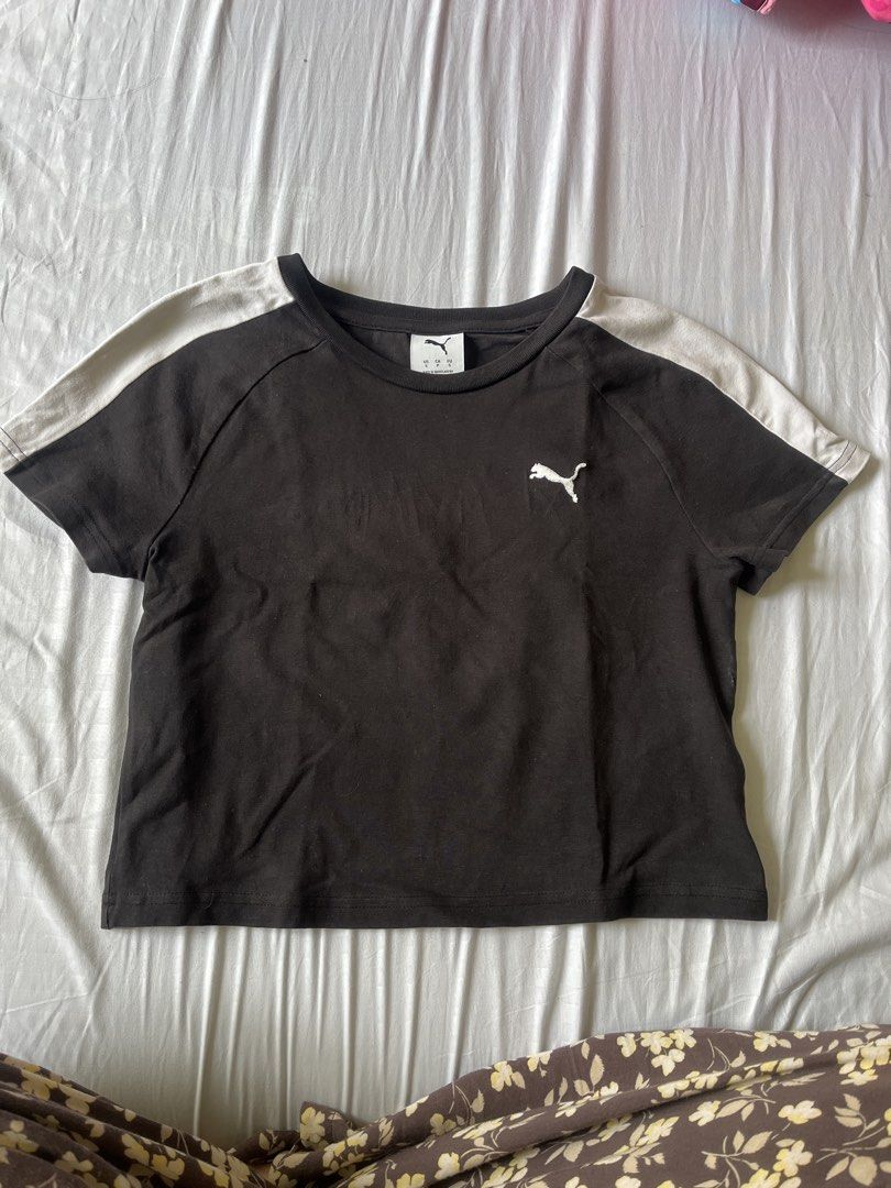Puma Black Cropped T-shirt (Category: Shirts) located in Caloocan City. Submitted by daenty.mnl (Listing ID 1459719353, Image 1). Description: - Black Puma cropped t-shirt - Features white stripes on the sleeves - Puma logo on the chest - Comfortable and casual design - Ideal for everyday wear or workouts - Easy to pair with jeans or shorts.