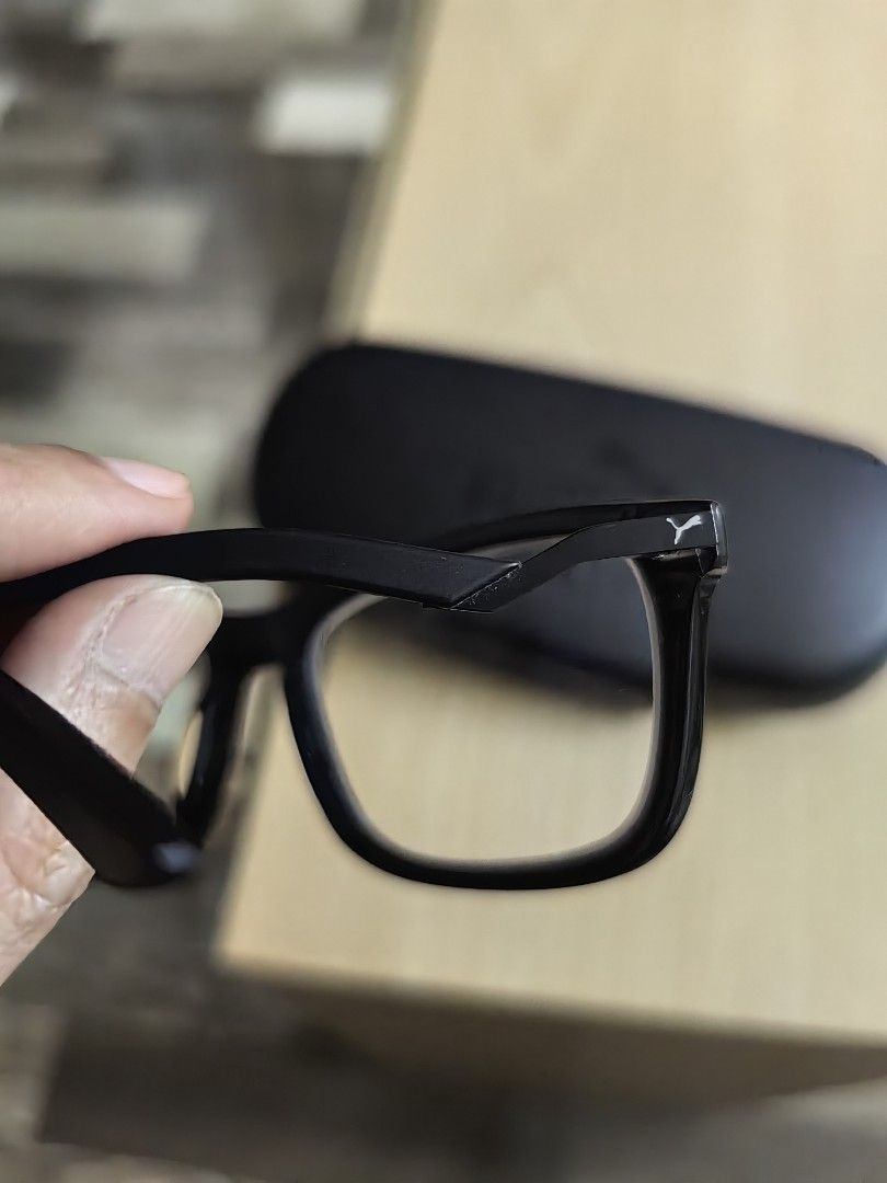 Puma Black Eyeglasses with Case (Category: Sunglasses & Eyewear) located in Cavite. Submitted by klosetnijuan (Listing ID 1459796468, Image 2). Description: Black Puma eyeglasses. Comes with a black Puma hard case. The frames are black with the Puma logo on the side. Good for everyday wear. Lenses are clear. Original price was 6k b.