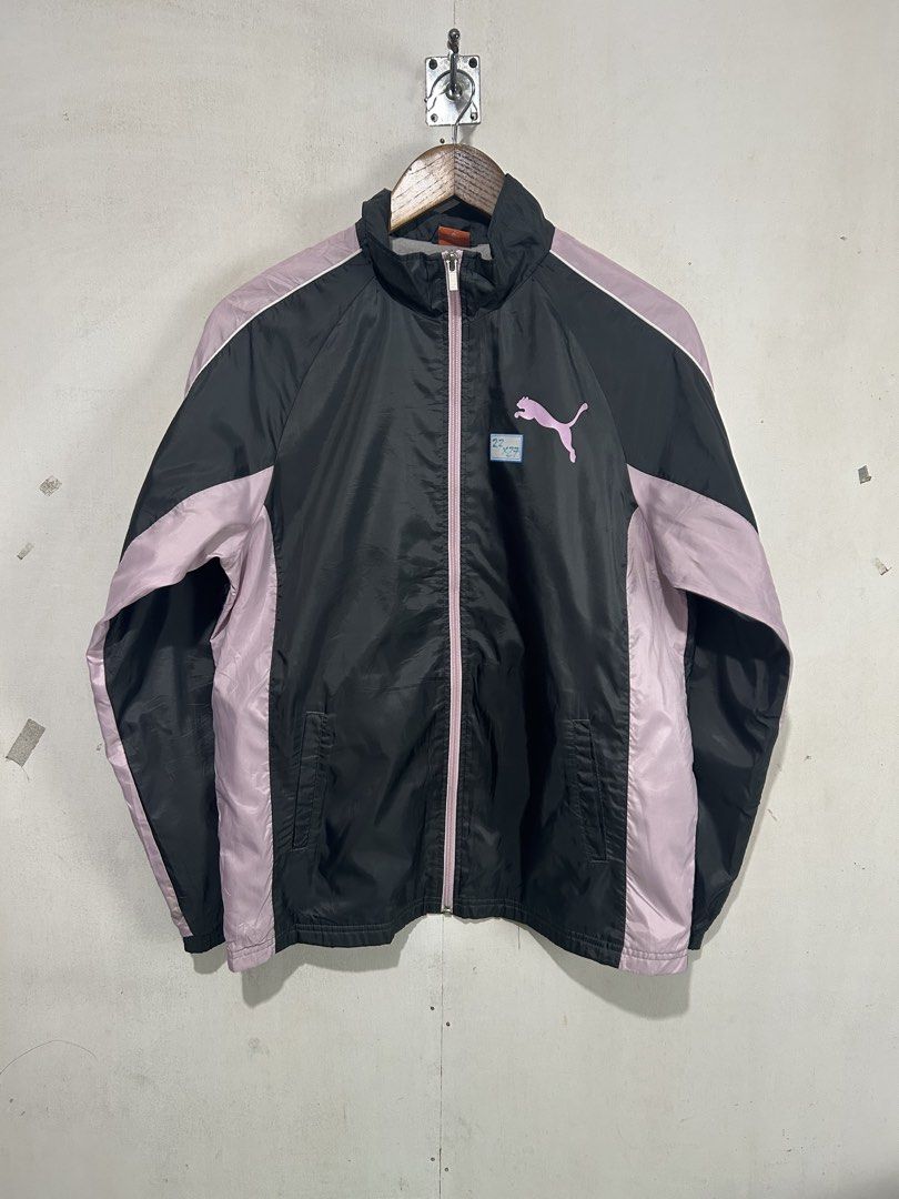 Puma Track Jacket Black Pink Windbreaker (Category: Coats, Jackets and Outerwear) located in Mandaluyong City. Submitted by 0lg2026 (Listing ID 1459689451, Image 1). Description: - Puma Track Jacket - Color: Black with Light Pink Accents - Full Zip Front with Branded Pull - Puma Logo on Chest - Lightweight Material - Ideal for Casual Wear or Sports - Made in China.