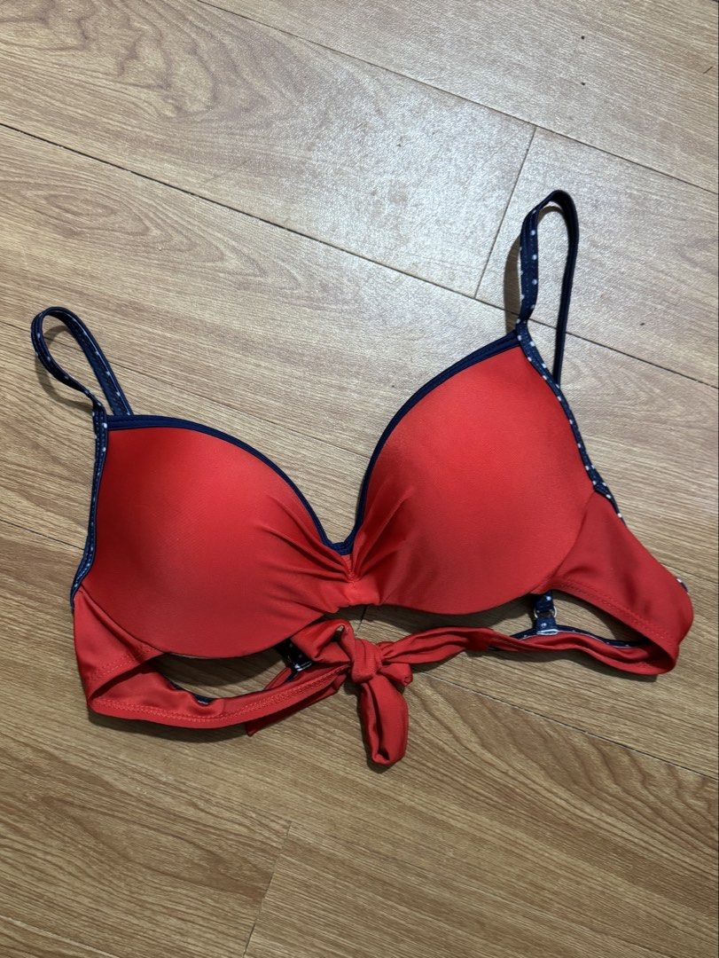 Red Polka Dot Push-Up Padded Top with Tie Back (Category: Bikinis & Swimsuits) located in Makati City. Submitted by closetwithandrea (Listing ID 1459829826, Image 1). Description: - Adorable red bikini top - Navy blue polka dot trim - Flattering tie-front detail - Adjustable straps for a perfect fit - Padded cups for support and shape - Ideal for beach days, pool parties, and your next vacation!.