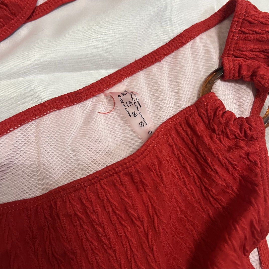 Red Textured Bikini with Ring Detail (Category: Bikinis & Swimsuits) located in Imus. Submitted by niftees.eco (Listing ID 1459749968, Image 3). Description: Red textured bikini set. Size S. Features ring detail and strapless top. High-cut bottoms. Shein brand..