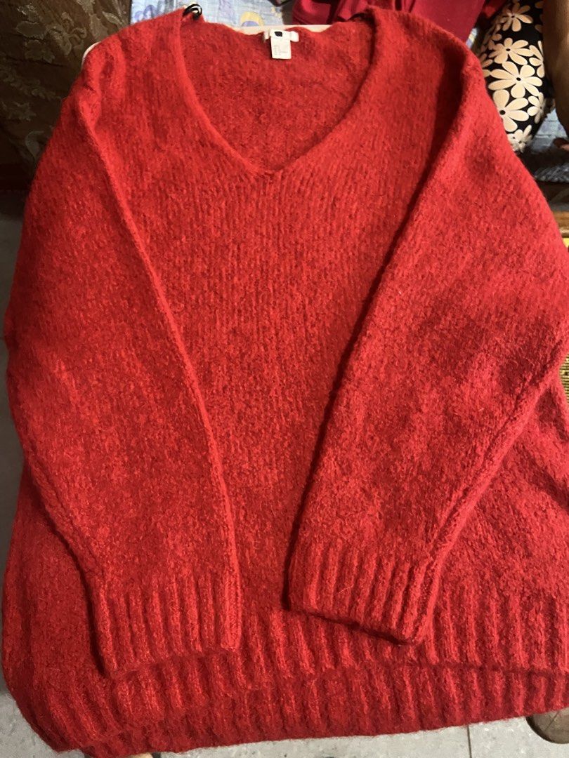 Red V-neck Knit Sweater (Category: Coats, Jackets and Outerwear) located in Taguig. Submitted by billpogi23 (Listing ID 1459731360, Image 1). Description: - Cozy red v-neck sweater - Textured knit fabric - Ribbed cuffs and hem - Perfect for layering or wearing solo - Easily dressed up or down.