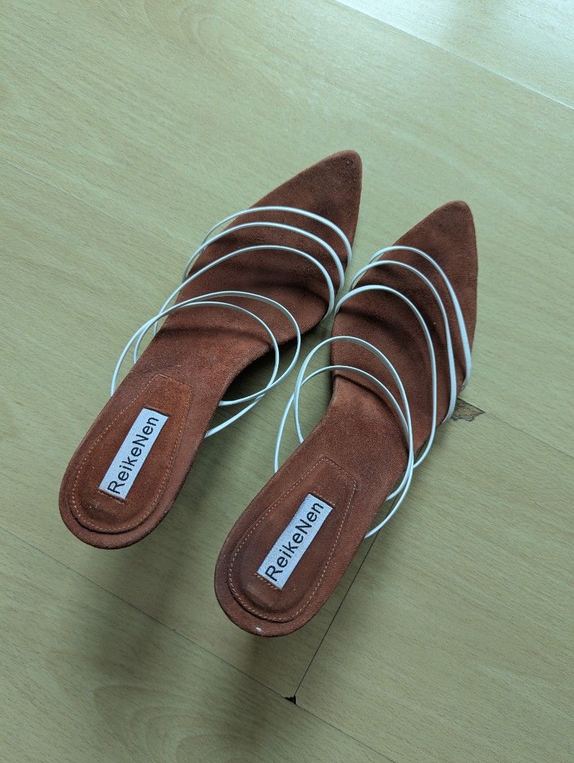 Reike Nen Heels Size 38 (Category: Heels) located in Taguig. Submitted by hlco13 (Listing ID 1459693611, Image 1). Description: - Brand: ReikeNen - Size: 38 - Material: Brown Suede - Design: Pointed toe slip-on mules - Details: White strap accents - Style Tip: Great for dressing up your look.