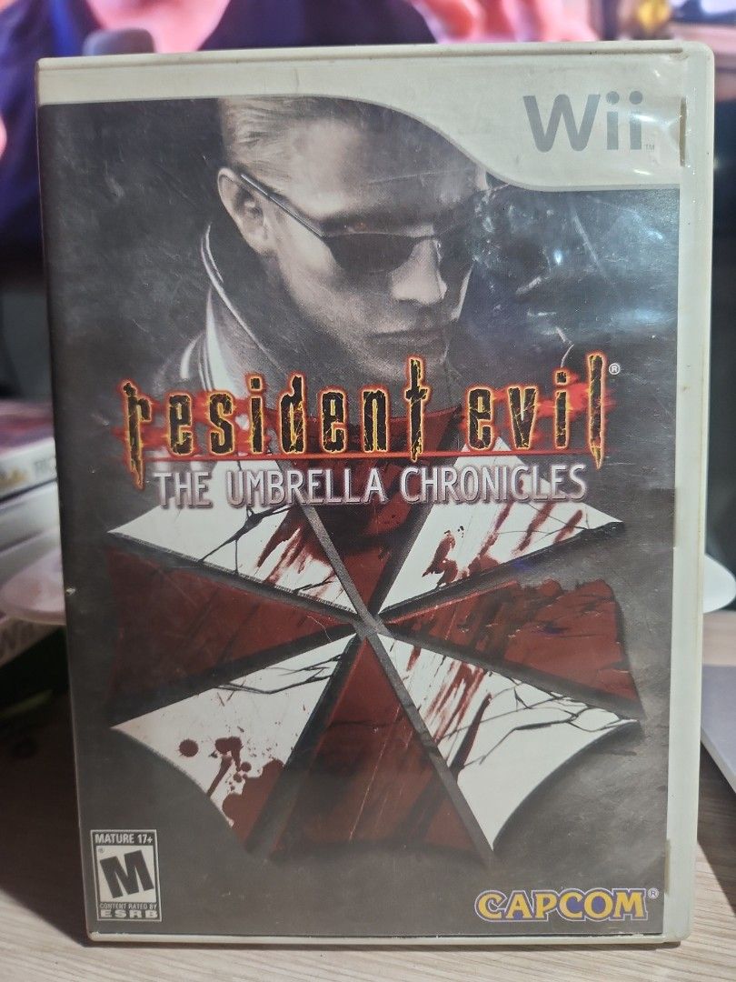 Resident Evil The Umbrella Chronicles Wii Game (Category: Nintendo) located in Quezon City. Submitted by gwift (Listing ID 1459700547, Image 1). Description: - Resident Evil: The Umbrella Chronicles for Nintendo Wii. - Battle swarms of undead creatures and mutated terrorists. - Compatible with Wii Zapper for immersive light-gun gameplay. - Features a new location: Umbrella's stronghold. -selling based on current US market value x 50 -price subjec