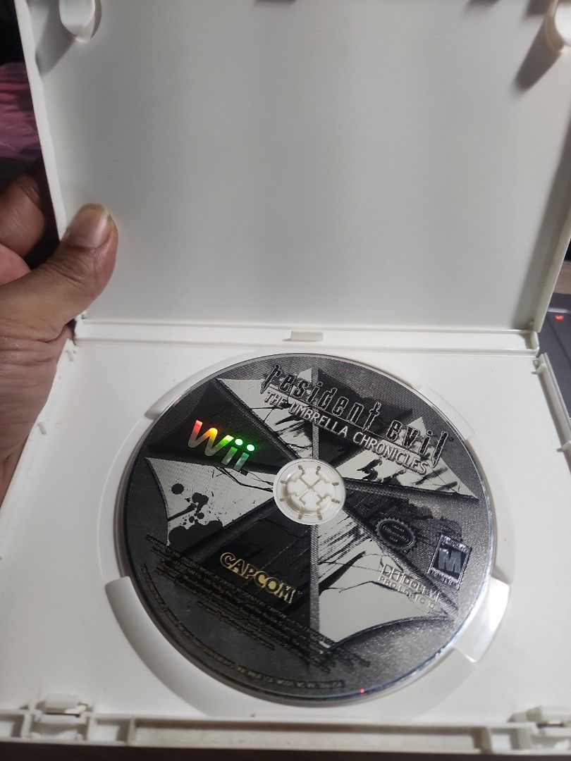 Resident Evil The Umbrella Chronicles Wii Game (Category: Nintendo) located in Quezon City. Submitted by gwift (Listing ID 1459700547, Image 3). Description: - Resident Evil: The Umbrella Chronicles for Nintendo Wii. - Battle swarms of undead creatures and mutated terrorists. - Compatible with Wii Zapper for immersive light-gun gameplay. - Features a new location: Umbrella's stronghold. -selling based on current US market value x 50 -price subjec