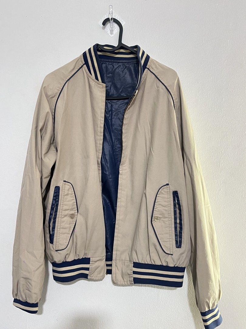 Reversible Bomber Jacket - Blue & Tan (Category: Coats, Jackets and Outerwear) located in Manila. Submitted by mazerunnr (Listing ID 1459757138, Image 3). Description: - Reversible bomber jacket for versatile styling - Side 1: Shiny blue with white and blue striped trim - Side 2: Tan with navy blue trim and pocket details - Full zipper closure - Ribbed cuffs and hem for a snug fit.