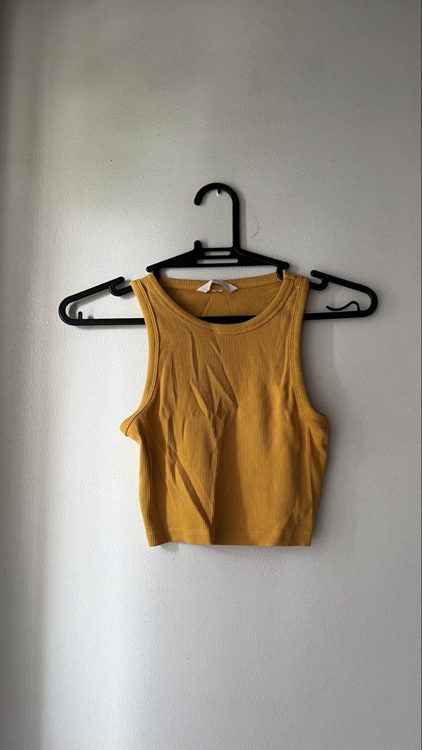 Ribbed Mustard Yellow Cropped Tank Top (Category: Sleeveless) located in Quezon City. Submitted by deargenna (Listing ID 1459821868, Image 1). Description: - Mustard yellow ribbed cropped tank top - Sleeveless with racerback design - Stretchy and comfortable fit - Versatile for layering or wearing solo - Pairs well with jeans or shorts * 💳 MOP: GCash / Bank Transfer * 🛵 MOD: Same-day delivery via Lalamove / Grab (Buyer pays SF) * 📍 Pick-Up: Gr