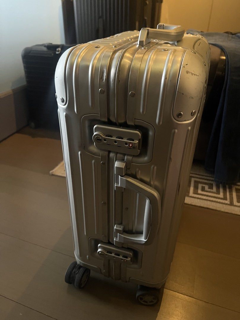 Rimowa Original Aluminum (Category: Luggage) located in Muntinlupa City. Submitted by goodsbymjp (Listing ID 1459780944, Image 3). Description: - Classic Rimowa aluminum suitcase - Silver color with iconic grooved design - Features TSA combination locks - Wheels are intact and fully functional - Minor scuffs and scratches from normal travel use - Still a very solid and stylish piece for your trips.