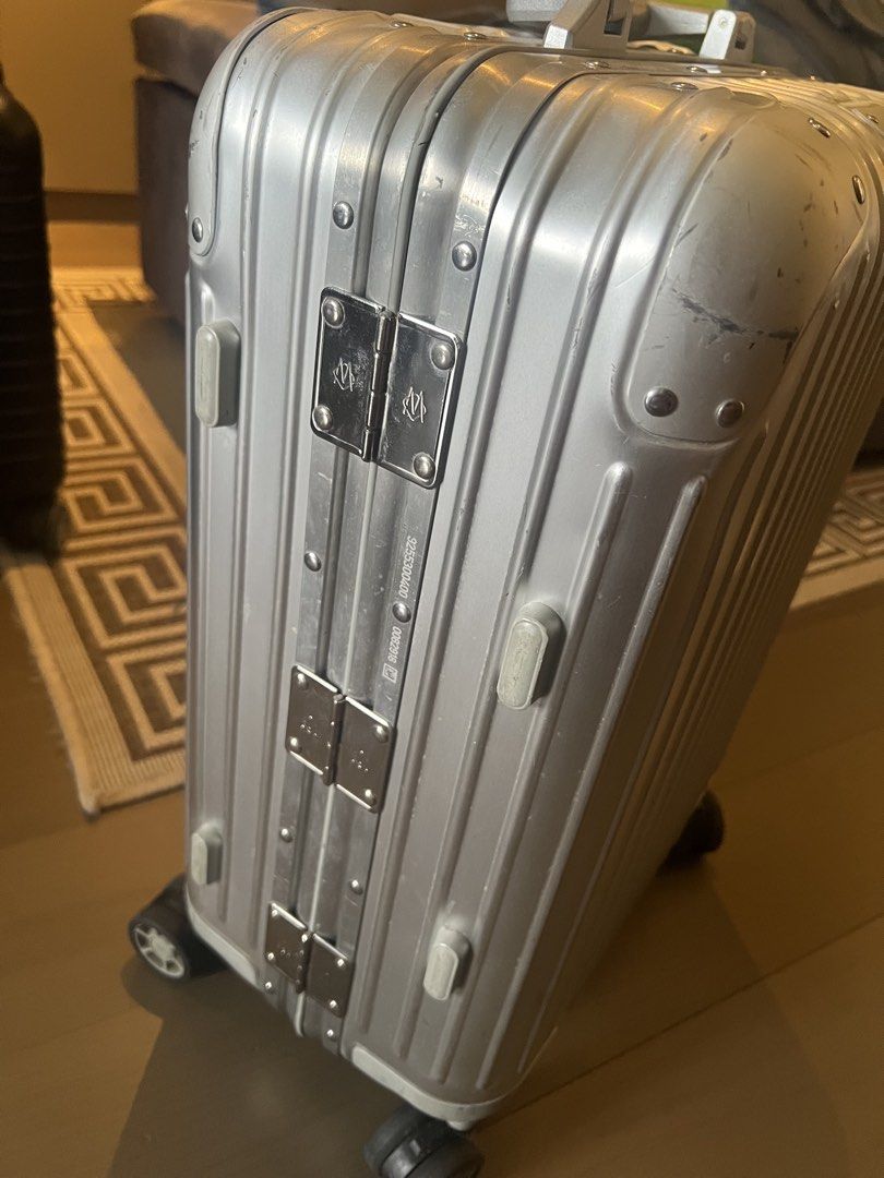 Rimowa Original Aluminum (Category: Luggage) located in Muntinlupa City. Submitted by goodsbymjp (Listing ID 1459780944, Image 2). Description: - Classic Rimowa aluminum suitcase - Silver color with iconic grooved design - Features TSA combination locks - Wheels are intact and fully functional - Minor scuffs and scratches from normal travel use - Still a very solid and stylish piece for your trips.