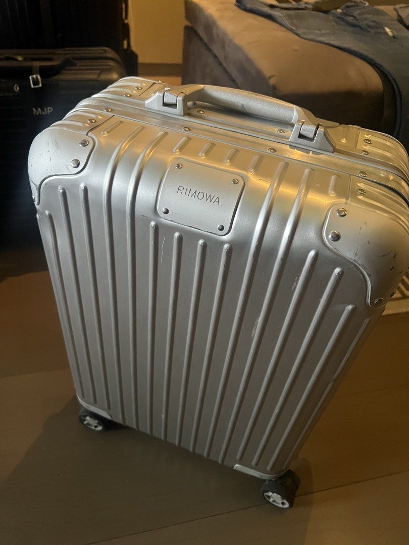 Rimowa Original Aluminum (Category: Luggage) located in Muntinlupa City. Submitted by goodsbymjp (Listing ID 1459780944, Image 1). Description: - Classic Rimowa aluminum suitcase - Silver color with iconic grooved design - Features TSA combination locks - Wheels are intact and fully functional - Minor scuffs and scratches from normal travel use - Still a very solid and stylish piece for your trips.