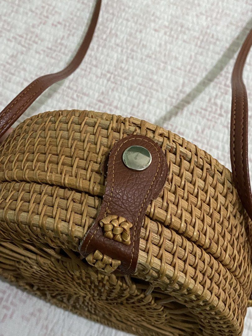 Round Rattan Crossbody Bag (Category: Cross-body Bags) located in Angeles City. Submitted by dwnmxn (Listing ID 1459738925, Image 2). Description: Round Rattan Crossbody Bag - Bought in Bangkok - Natural woven material - Brown leather strap and closure - Button snap closure - Fabric-lined interior - Ideal for beach trips or casual outings - Unique circular design.