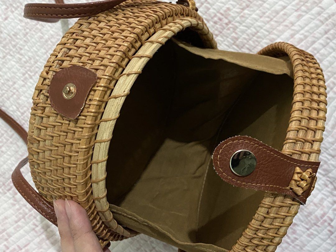 Round Rattan Crossbody Bag (Category: Cross-body Bags) located in Angeles City. Submitted by dwnmxn (Listing ID 1459738925, Image 3). Description: Round Rattan Crossbody Bag - Bought in Bangkok - Natural woven material - Brown leather strap and closure - Button snap closure - Fabric-lined interior - Ideal for beach trips or casual outings - Unique circular design.