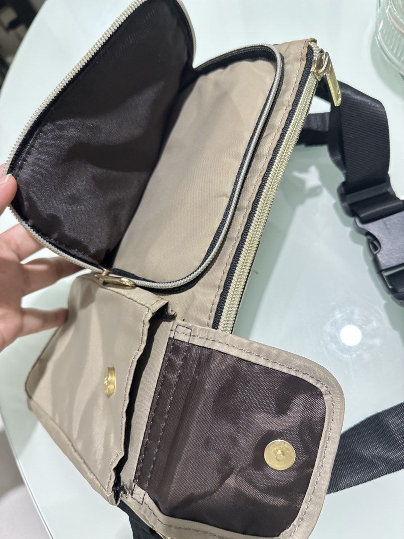 Rurubu Waist Pouch Bag (Category: Purses & Pouches) located in Mandaluyong City. Submitted by TheWeekendProject (Listing ID 1459762073, Image 3). Description: - Stylish tan/beige waist pouch - Multiple pockets and zippers for organization - Adjustable strap for versatile wear (waist or crossbody) - Ideal for travel and everyday use - Clean interior and exterior - Ready for its next adventure!.