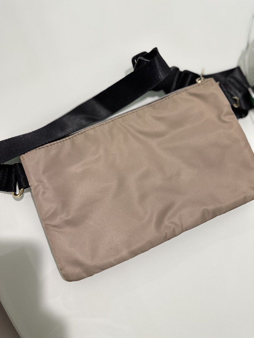 Rurubu Waist Pouch Bag (Category: Purses & Pouches) located in Mandaluyong City. Submitted by TheWeekendProject (Listing ID 1459762073, Image 2). Description: - Stylish tan/beige waist pouch - Multiple pockets and zippers for organization - Adjustable strap for versatile wear (waist or crossbody) - Ideal for travel and everyday use - Clean interior and exterior - Ready for its next adventure!.