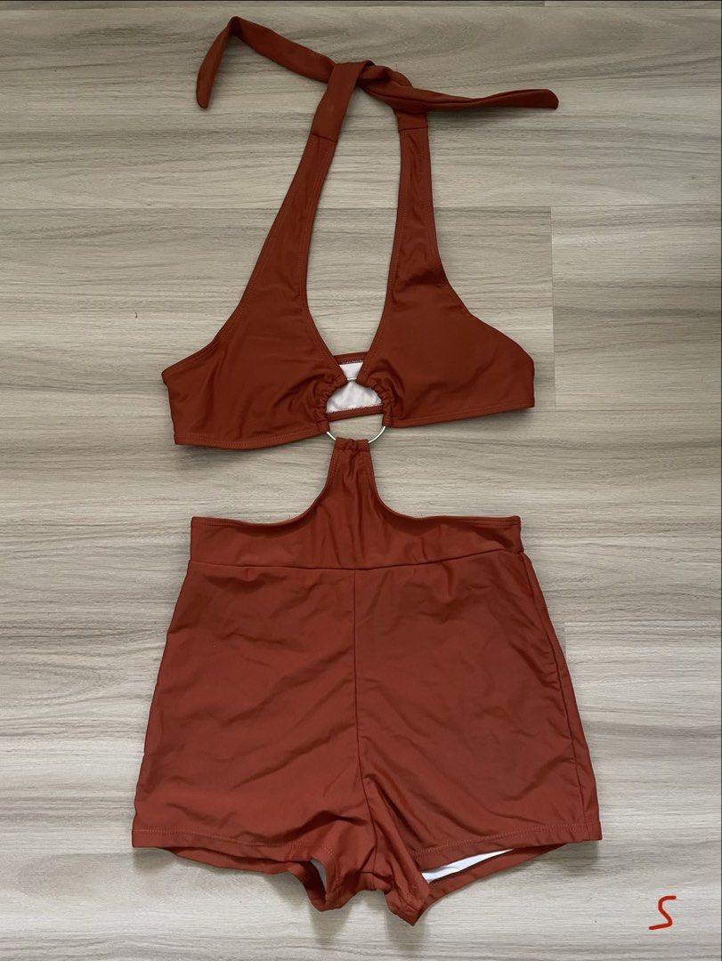 Rust Halter Neck Bikini Set with Ring Detail (Category: Bikinis & Swimsuits) located in Manila. Submitted by possiblymaybe.717 (Listing ID 1459782457, Image 1). Description: - Cute rust-colored bikini set - Halter neck top with stylish metal ring detail - Matching high-waisted shorts - Comfortable and stylish design - Ideal for beach or pool days - Size: Small (S).