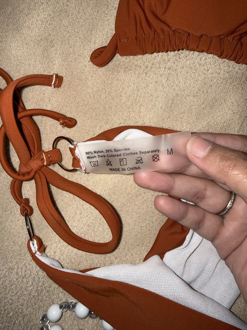 Rust Orange Ring Detail Bikini Set (Category: Bikinis & Swimsuits) located in Taguig. Submitted by cosmic.jengck320 (Listing ID 1459799815, Image 2). Description: - Trendy rust orange bikini set - Features stylish ring details on straps - Adjustable ties for a perfect, custom fit - Comfortable nylon and spandex blend fabric - Fits S to M - Care instructions: Hand wash dark colors separately.