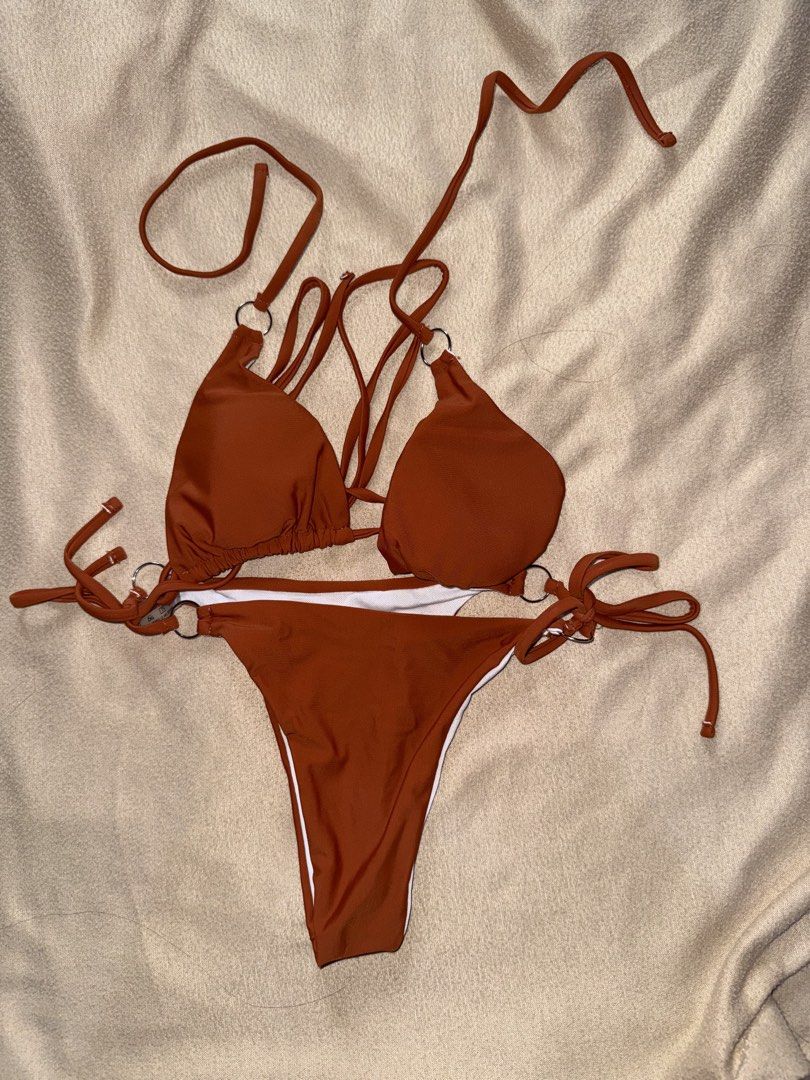 Rust Orange Ring Detail Bikini Set (Category: Bikinis & Swimsuits) located in Taguig. Submitted by cosmic.jengck320 (Listing ID 1459799815, Image 1). Description: - Trendy rust orange bikini set - Features stylish ring details on straps - Adjustable ties for a perfect, custom fit - Comfortable nylon and spandex blend fabric - Fits S to M - Care instructions: Hand wash dark colors separately.