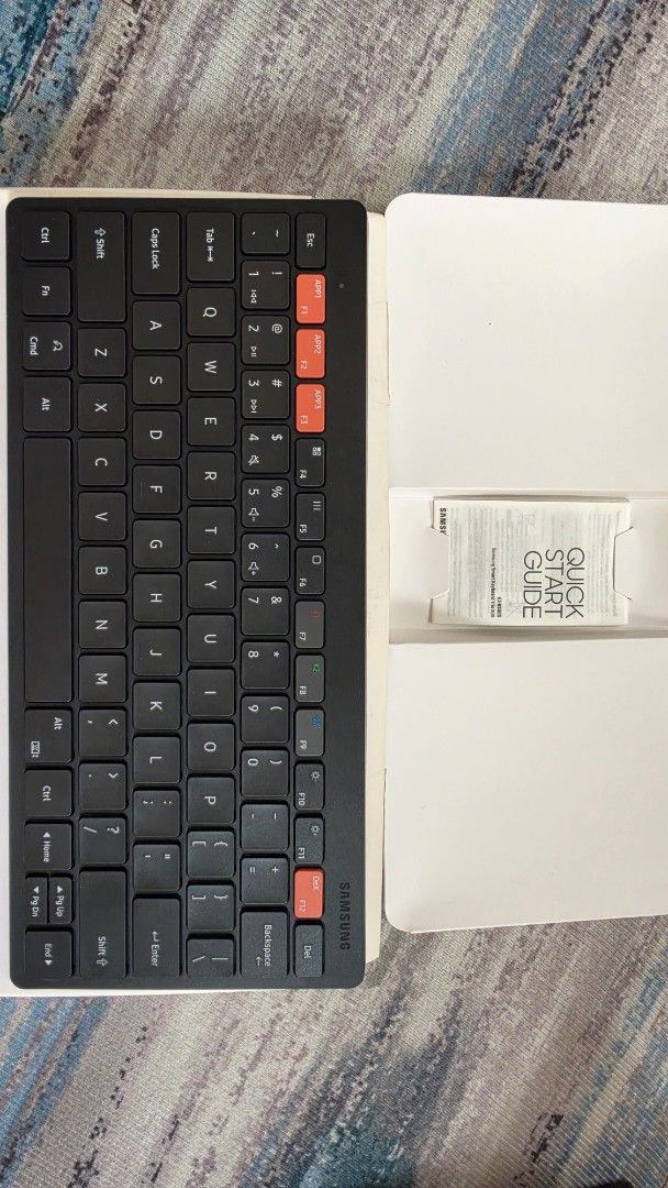 Samsung Smart Keyboard Trio 500 (Category: Computer Keyboard) located in Manila. Submitted by happykyz (Listing ID 1459719134, Image 3). Description: SAMSUNG SMART KEYBOARD TRIO 500 Wireless connectivity for seamless pairing. - Dedicated keys for quick app access and Samsung DeX. - Slim and portable design, ideal for on-the-go use. - Works great with both smartphones and tablets. - Includes original box and quick start guide..