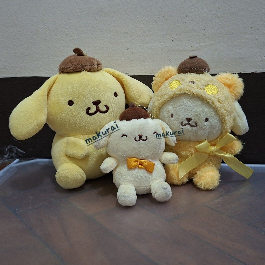 Sanrio Pompompurin Plush Toys Set (Category: Plushies & Soft Toys) located in Manila. Submitted by maku.raish (Listing ID 1459782727, Image 1). Description: - Set of 3 Pompompurin plush toys - Includes mascot size Pompompurin, small Pompompurin with bow, and Pompompurin in fluffy costume - All plush toys feature the signature brown hat - Ideal for Sanrio enthusiasts and collectors - Cute and collectible items ⚠️ Pre-loved item: Please manage expe