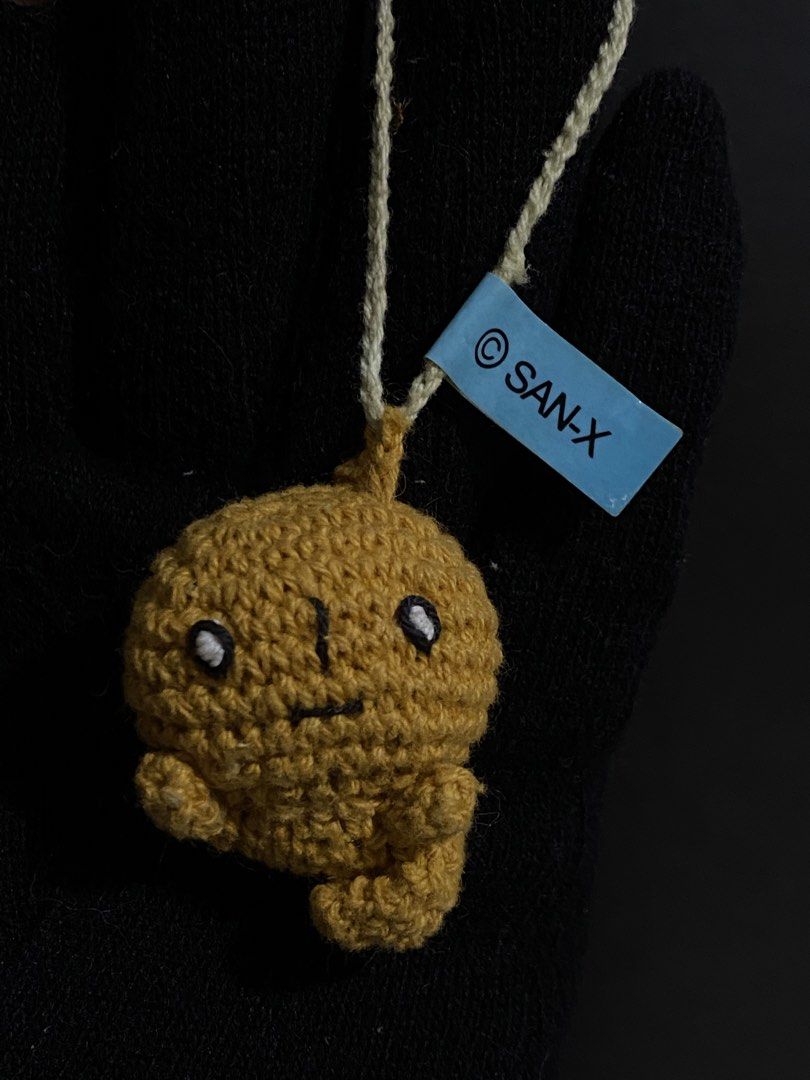 San-X Crochet Plush Charm with Tag (Category: Handmade Craft) located in Davao. Submitted by hoowans_surplus (Listing ID 1459886901, Image 1). Description: - Adorable crochet plush charm - Yellowish-brown color - Features a convenient hanging string - Includes original San-X tag - Ideal for decorating bags or keys - Small and portable design.