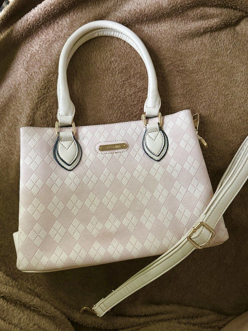 Secosana Pink and Cream Checkered Bag (Category: Shoulder Bags) located in Caloocan City. Submitted by lovedbyzee (Listing ID 1459630428, Image 1). Description: Brand: Secosana Color: Baby Pink & Cream with gold hardware Features: - Metal logo still has its protective plastic cover - Textured checkered pattern exterior - Top carry handles - Includes a detachable and adjustable long strap/sling - Multi-compartment interior with zip pockets and mag