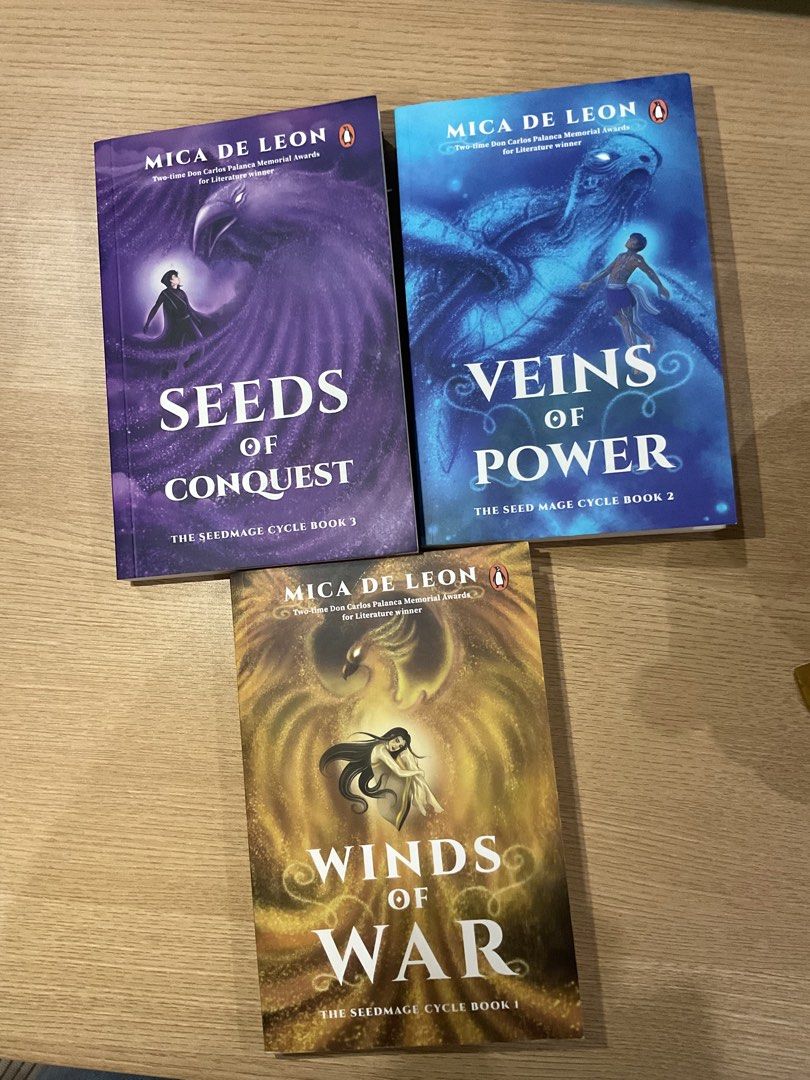 Seedmage Cycle Trilogy | Mica de Leon (Category: Storybooks) located in Tagum. Submitted by crstnetngyoc (Listing ID 1459830625, Image 1). Description: Sold as set only. Bought at NBS last april 2026. RFS: Decluttering. 1. Winds of War 2. Veins of Power 3. Seeds of Conquest.