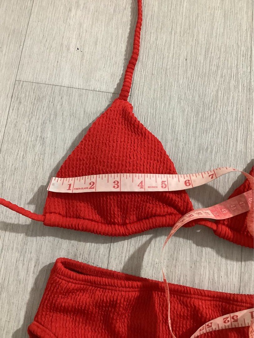 Sewlocal Red Textured Triangle Bikini Set (Category: Bikinis & Swimsuits) located in Caloocan City. Submitted by soldbyann (Listing ID 1459805544, Image 2). Description: - Red textured bikini set - Triangle top with adjustable tie straps - High-waisted bottoms - Top cup width: approx. 5 inches - Bottom waistband: approx. 13 inches - Ideal for beach days or poolside lounging.
