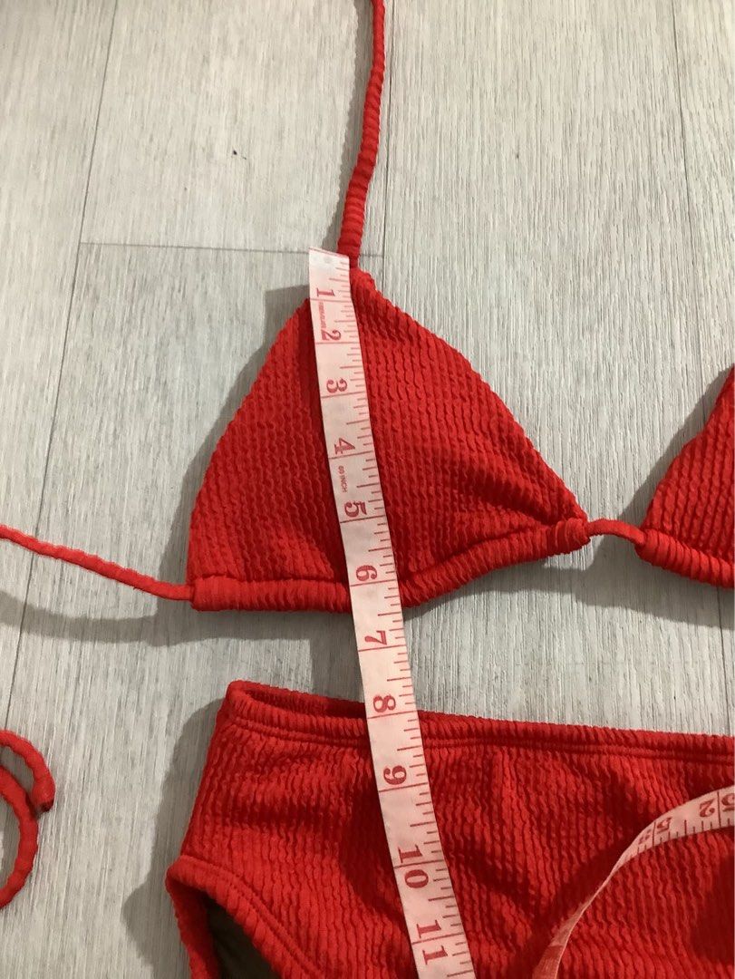 Sewlocal Red Textured Triangle Bikini Set (Category: Bikinis & Swimsuits) located in Caloocan City. Submitted by soldbyann (Listing ID 1459805544, Image 3). Description: - Red textured bikini set - Triangle top with adjustable tie straps - High-waisted bottoms - Top cup width: approx. 5 inches - Bottom waistband: approx. 13 inches - Ideal for beach days or poolside lounging.