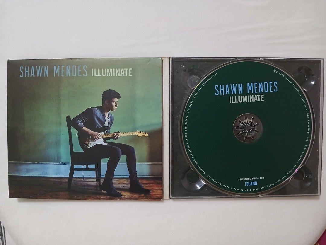 Shawn Mendes Illuminate CD Album (Category: CDs & DVDs) located in Manila. Submitted by angela_f1234 (Listing ID 1459751867, Image 3). Description: - Shawn Mendes Illuminate CD - Includes all original tracks - Includes bonus tracks: Hold On, Roses, Mercy Acoustic Ver - Comes with original case and booklet with lyrics and thank you message from the artist - Perfect for any Shawn Mendes fan.