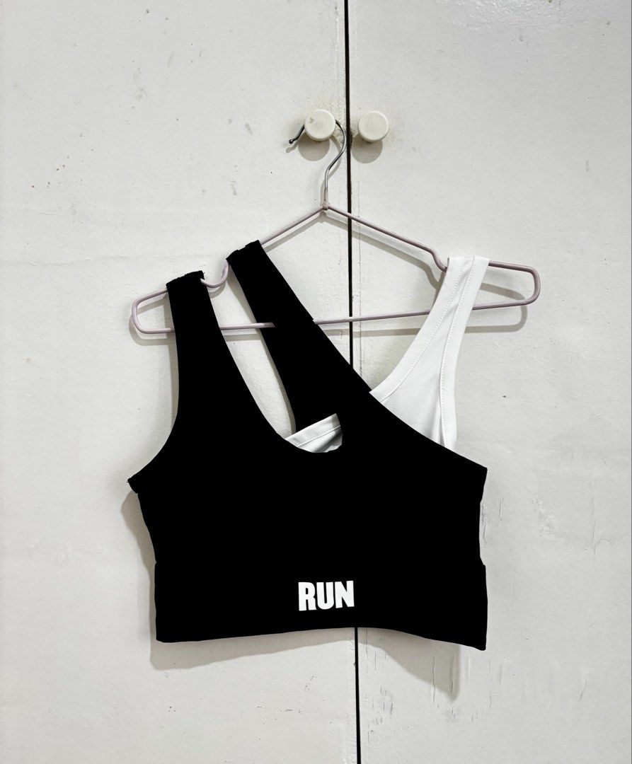 SHEIN Black & White Sports Bra (Category: Activewear) located in Manila. Submitted by dianafayesimbre (Listing ID 1459833367, Image 1). Description: - SHEIN sports bra - Size: S on tag but can fit xs to m - Color: Black with 'RUN' print, White - Features unique strap designs - Ideal for workouts and casual wear - Brand new - Unpadded.