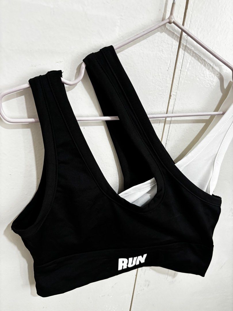 SHEIN Black & White Sports Bra (Category: Activewear) located in Manila. Submitted by dianafayesimbre (Listing ID 1459833367, Image 2). Description: - SHEIN sports bra - Size: S on tag but can fit xs to m - Color: Black with 'RUN' print, White - Features unique strap designs - Ideal for workouts and casual wear - Brand new - Unpadded.