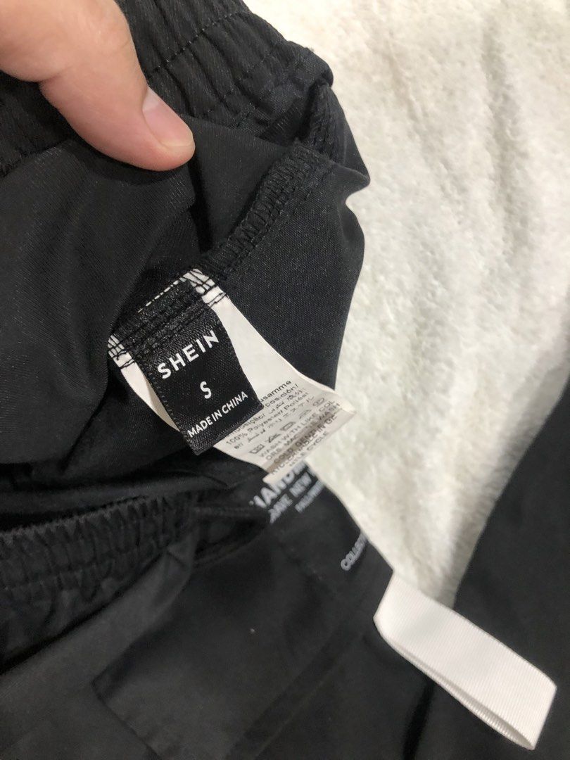 SHEIN Black Cargo Pants Size S (Category: Other Bottoms) located in Manila. Submitted by janmichael26601 (Listing ID 1459769009, Image 3). Description: - Black cargo jogger pants from SHEIN - Tagged size S - Elastic waistband with adjustable drawstring - Two side pockets and two back pockets - Jogger style with elastic cuffs - Ideal for everyday casual wear - Made in China.