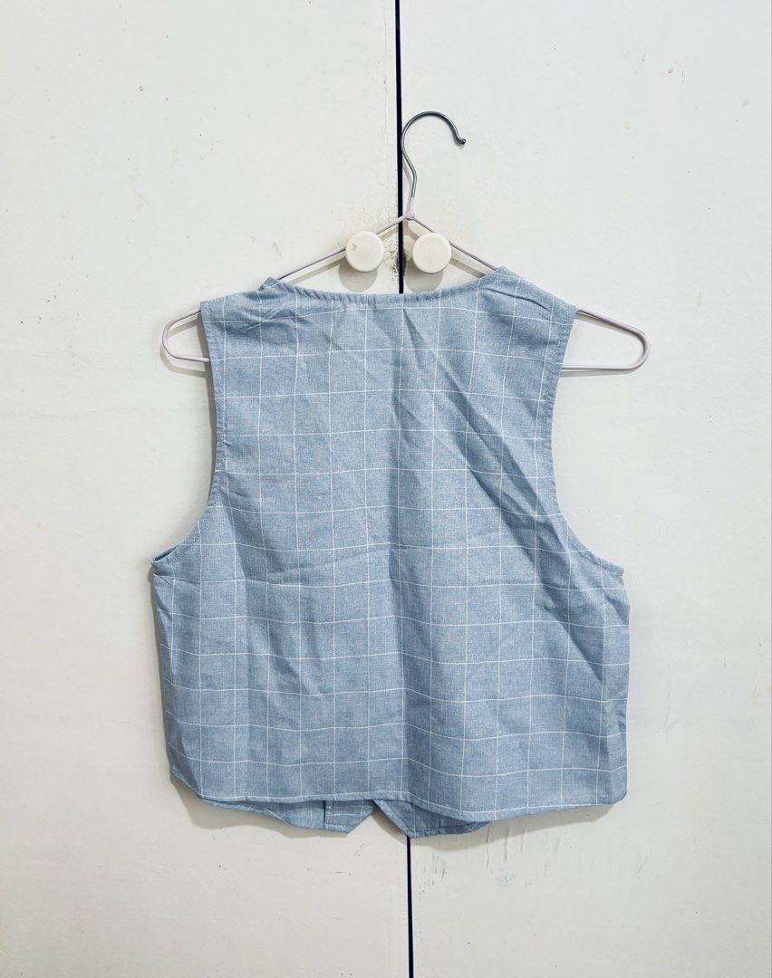 SHEIN Blue Plaid Vest (Category: Coats, Jackets and Outerwear) located in Manila. Submitted by dianafayesimbre (Listing ID 1459723023, Image 3). Description: - SHEIN Blue Plaid Vest - Size: 10Y in tag but can also fit Small to Semi L on womens - Button front closure - Two functional front pockets - Perfect for layering - Great for smart casual outfits - Unisex.