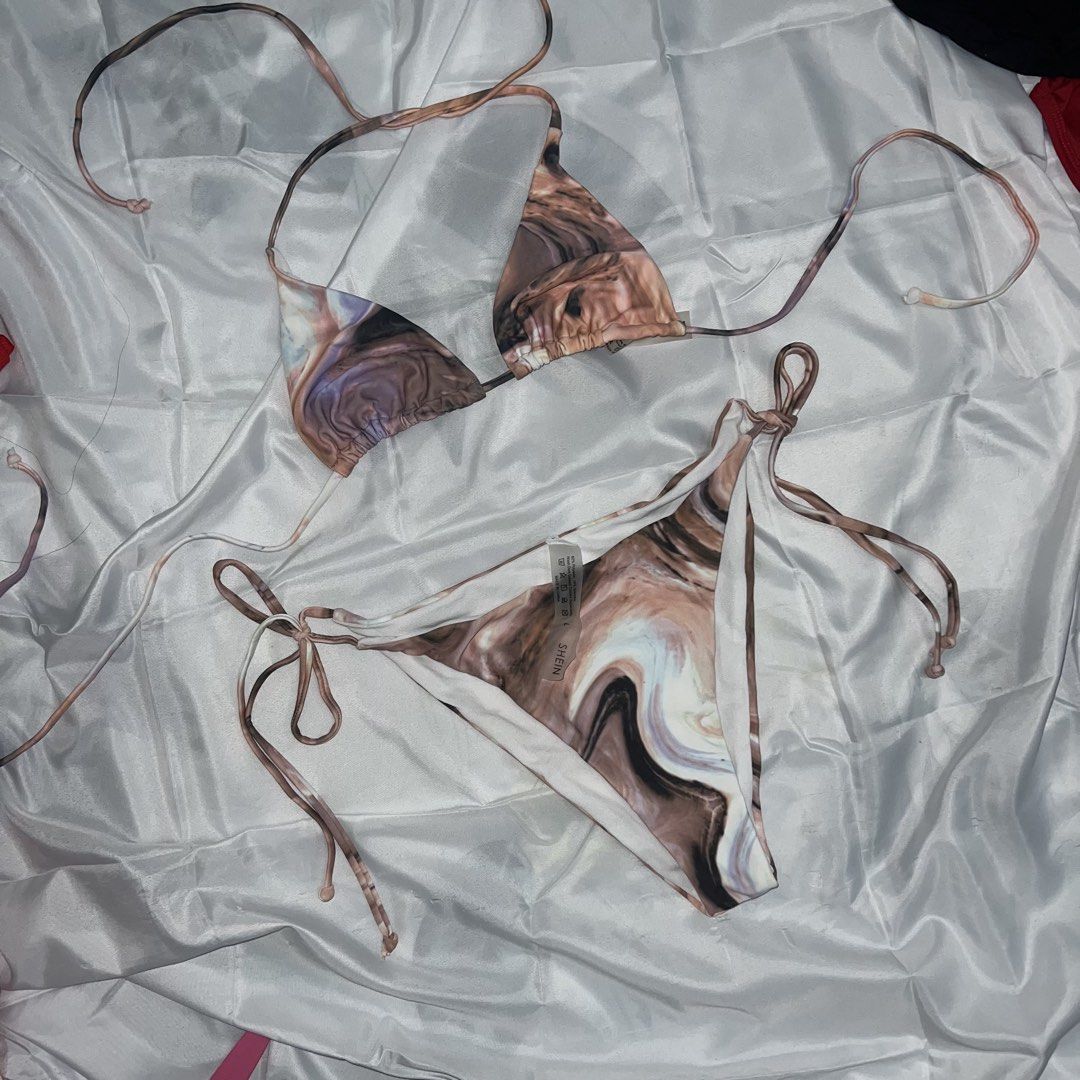 SHEIN Marble Print String Bikini (Category: Bikinis & Swimsuits) located in Imus. Submitted by niftees.eco (Listing ID 1459749012, Image 2). Description: SHEIN marble print string bikini. Triangle top and bottoms with adjustable ties. Size L. Great for beach/pool. L on tag but best fits to S-M .