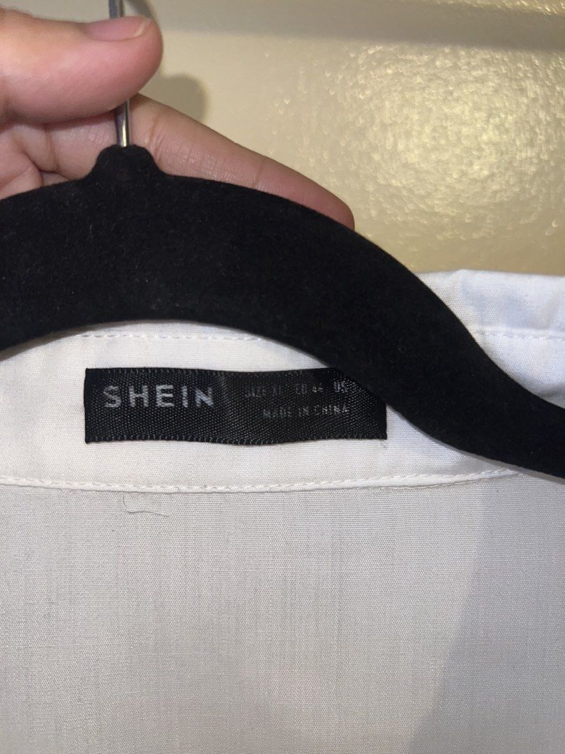 SHEIN White Cropped Oversized Button-Up Shirt (Category: Shirts) located in Mandaluyong City. Submitted by chelseayb47224 (Listing ID 1459815356, Image 3). Description: - SHEIN white button-up shirt - Cropped and oversized fit - Two chest pockets - Short sleeves with cuff - Easy to style for casual or dressy looks.
